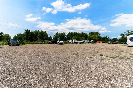 Gravel road parking spaces.