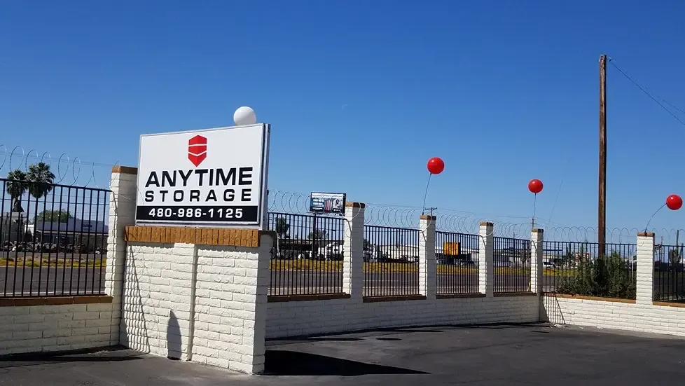 Anytime storage facility welcome sign with phone number visible
