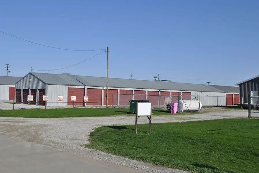 Street view of storage facility with gated fence.