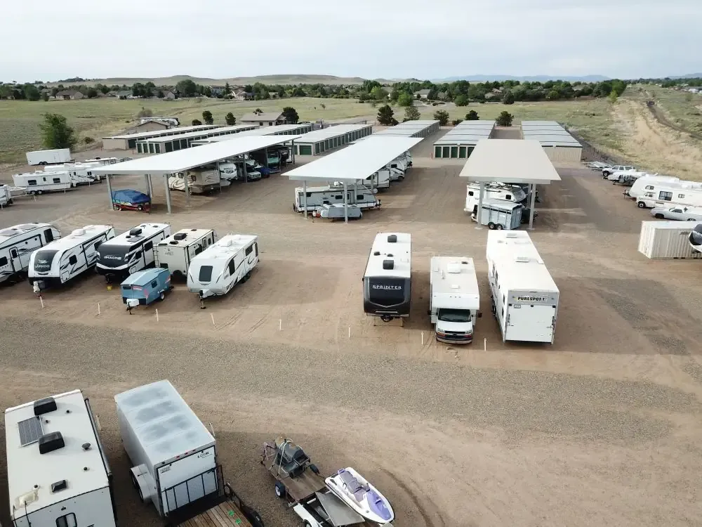 overlooking a storage facility with rv and vehicle parking covered and not covered with drive up storage units in the...