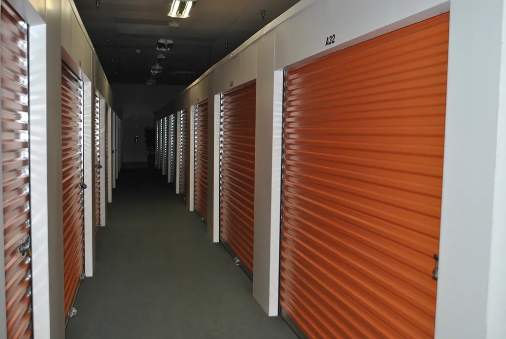 Row of indoor storage units with locks.