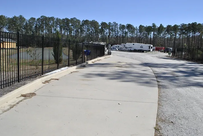 Gravel entrance to parking spaces.