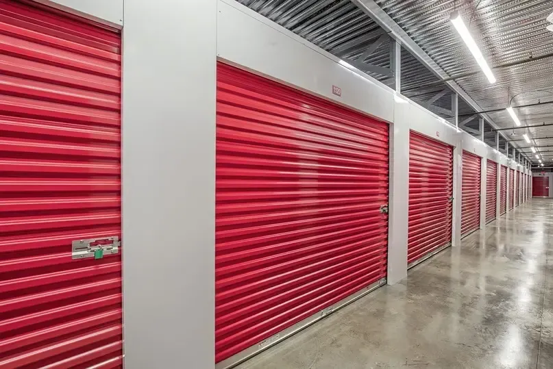 Large red doored storage unit inside