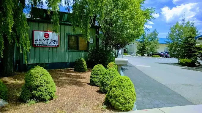 storage facility entrance with foliage and plants
