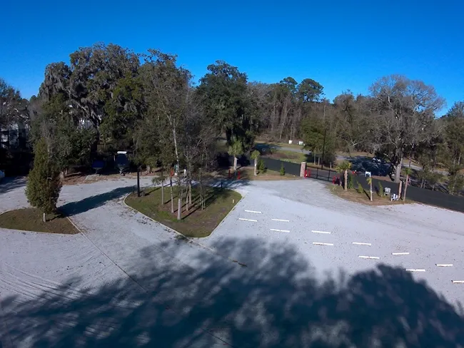 Storage facility lot with parking spaces.