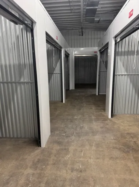 Hallway of storage units open.