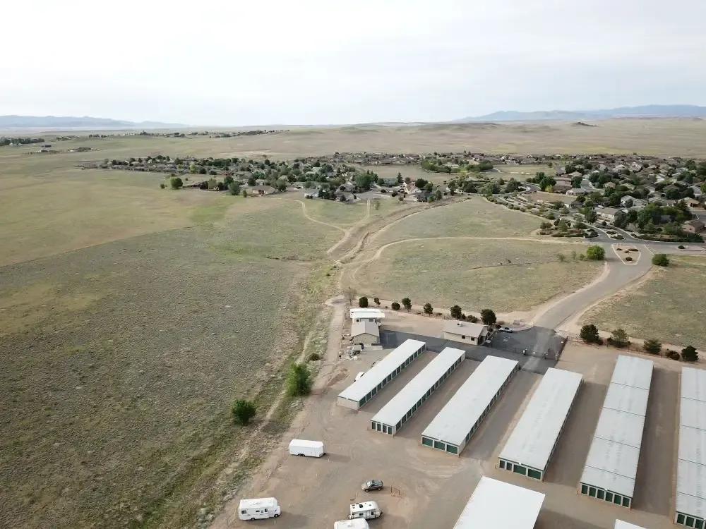 ariel view of a storage facility with drive up units and uncovered vehicle parking