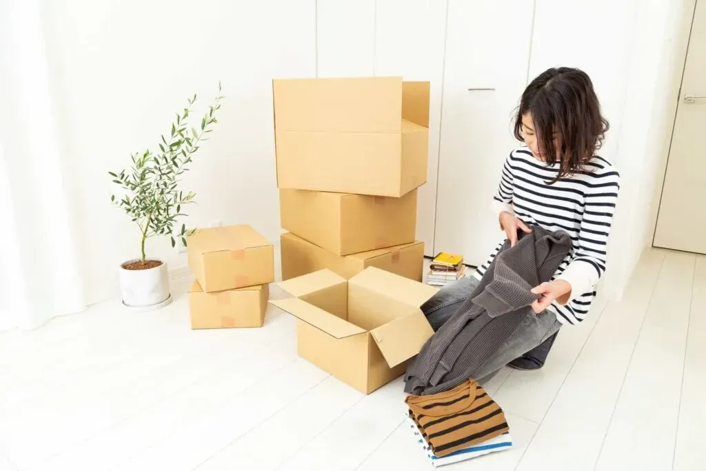 Woman Packing boxes for storage