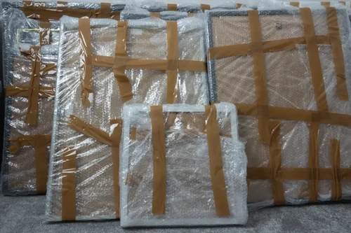Artwork wrapped in cardboard and Bubble Wrap prepped for storage.
