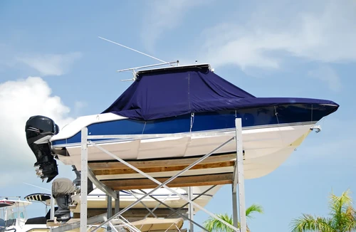 Boat stored with blue cover