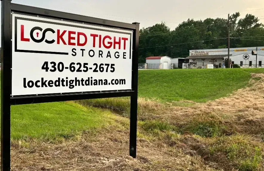 Locked Tight Storage signage on grass